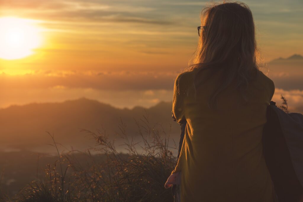 Girl watching the sunrise.