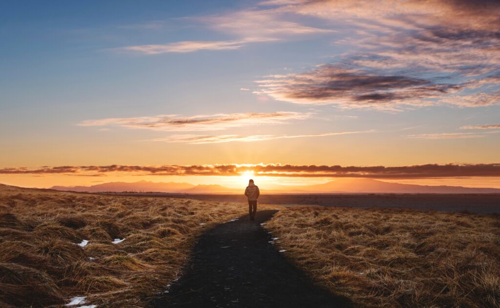 A man walking alone on footpath.