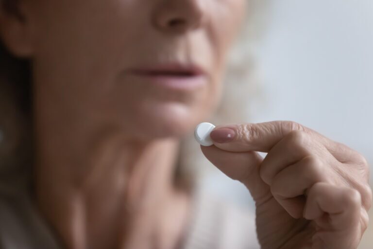 Close up of mature woman think of having medicines